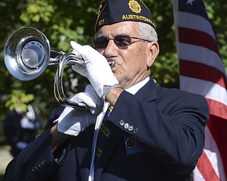 Katie Rickman | The Vindicator.Bob Kirchner of the American Legion Post 301 plays taps during the Mahoning Valley 9-11 Memorial Ceremony at the 9-11 Memorial Park on Raccoon Road on September 11, 2015.
