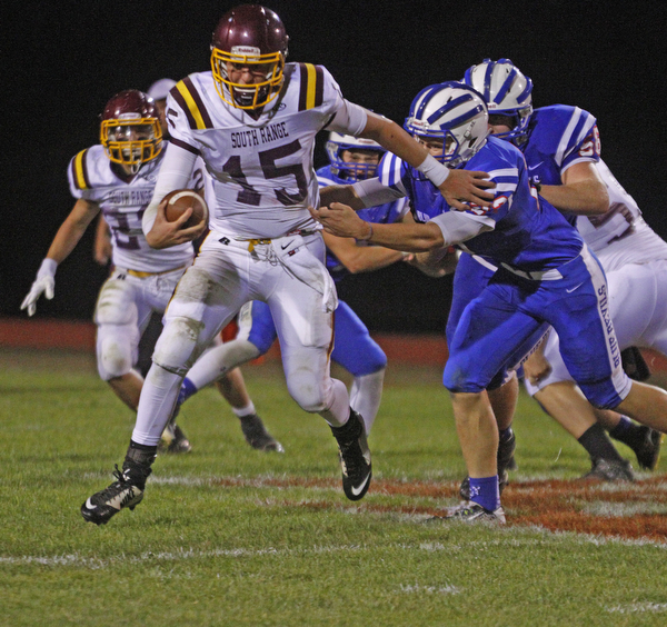       .         ROBERT  K. YOSAY | THE VINDICATOR..Raiders #15 Seth Morrow evades   #22 Bailey Brothag as he breaks for a first down during third quarter action ..South Range at Western Reserve ...-30-
