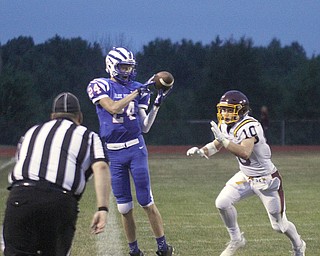       .         ROBERT  K. YOSAY | THE VINDICATOR..Blue Devil #24 Kade Hilles catches a sidelin e pass for a first down as Raiders #10 Greg Dunham can only watch..South Range at Western Reserve ...-30-