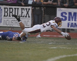       .         ROBERT  K. YOSAY | THE VINDICATOR..Raiders #22 Ethan Domingquez  Reaches for a TD after getting a first down by Blue Devil #86 Gregary Brunner..South Range at Western Reserve ...-30-