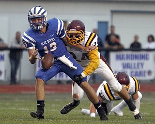       .         ROBERT  K. YOSAY | THE VINDICATOR..Blue Devils #13 Wyattt Larimer gets the ball stripped during second quarter action by Raiders 324 Taymer Graham - they recoverd during second quarter action..South Range at Western Reserve ...-30-