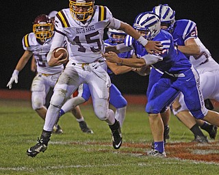       .         ROBERT  K. YOSAY | THE VINDICATOR..Raiders #15 Seth Morrow evades   #22 Bailey Brothag as he breaks for a first down during third quarter action ..South Range at Western Reserve ...-30-