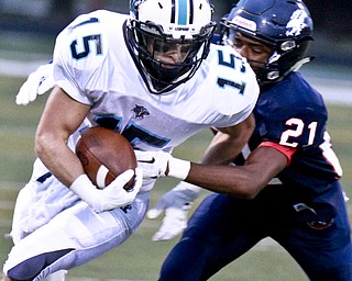 William D Lewis The Vindicator  Louisville's Tyler Adams(15) is stopped by fitch's Sammy Anderson(21) during 9-11 action at Fitch
