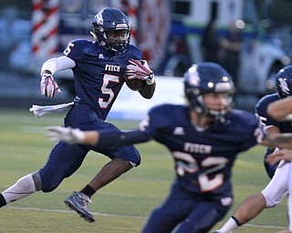 William D. Lewis The Vindicator  Fitch'sCarlos Herriott (5) scrambles for 1rst half yardage against Louisville 9-11 at Fitch.