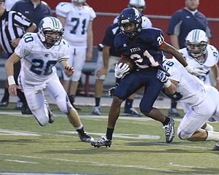 William D Lewis The Vindcator   Fitch'sSammy Anderson(21) eludes Louisville'sFrankFalcone(26) and Reis Rankin(20) during 9-11 action at Fitch...