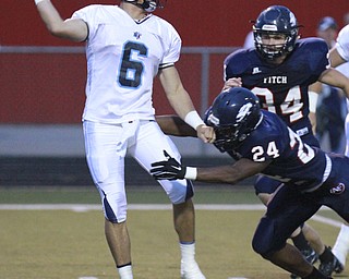 William D. Lewis The Vindicator  Fitch's Jakari Lumsden(24) and Bryce Warmouth(34) put pressure on Louisville QB Jacob Adams(6) during 9-11 action at Fitch.
