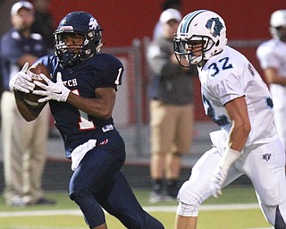 William D. Lewis The Vindicator  Fitch's Jaylon Sanders(1) pulls in a first Qtr pass past Louisville Stephen Kerzan(32) during 9-11 action at Fitch.