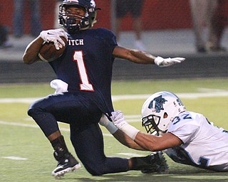 William D. Lewis The Vindicator  Fitch's Jaylon Sanders(1) pulls in a first Qtr pass past Louisville Stephen Kerzan(32) during 9-11 action at Fitch.