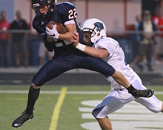 William D. Lewis The Vindicator  Fitch's JC Mikovich(22) scores with a first half TD pass past Louisville Reis Rankin(20) during 9-11 action at Fitch.