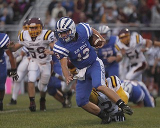       .         ROBERT  K. YOSAY | THE VINDICATOR..Blue Devils #13 Wyatt Larimer breaks a tackle by Raider #24 Taymer Graham as he tries to make a first down South Range at Western Reserve ...-30-