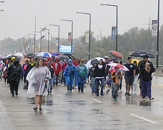 Katie Rickman | The Vindicator.Roughly 100 participants walk over the Market Street bridge while participating in the Walk Against Heroin which started at CCA at 1806 Market St and ended at the court house downtown on September 12, 2015.
