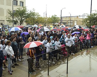 Katie Rickman | The Vindicator.Roughly 100 stand in the rain and listen to Nichole Walmsley, organizer of Walk Against Heroin which started at CCA at 1806 Market St and ended at the court house downtown on September 12, 2015.