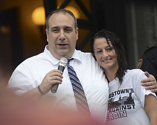 Katie Rickman | The Vindicator.Leonard Campanello, Police Chief in Gloucester, Massachusetts  wraps his arm around Nicole Walmsley as he addresses the crowd at the Walk Against Heroin which started at CCA at 1806 Market St and ended at the court house downtown on September 12, 2015.