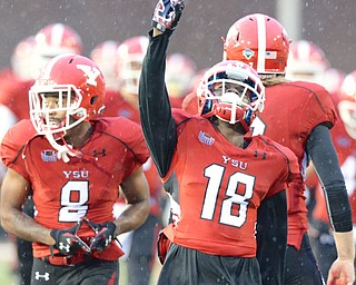 Jeff Lange | The Vindicator  SEPTEMBER 12, 2015 - YSU's DJ Thomas runs onto the field prior to Saturday evening's game against RMU at Stambaugh Stadium..