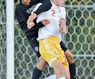 Jeff Lange | The Vindicator  SEPTEMBER 15, 2015 - CVCA's Daniel Chung (left) heads the ball against Mooney's Evan Leek (2) during first half action of their matchup in Struthers on Tuesday night.