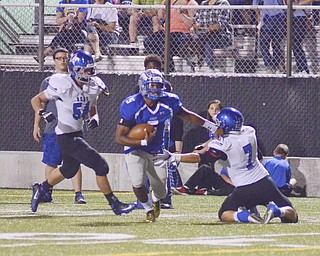 Katie Rickman | The Vindicator.Hubbard's Cam Ingram (#5) holds back Lakeview's Tim Robert (#7) during the first half of the game at Hubbard on Friday, September 18, 2015.