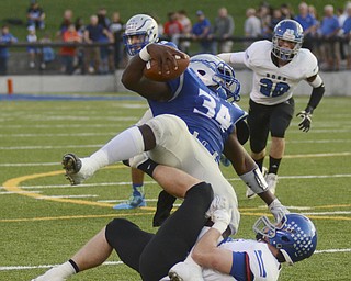 Katie Rickman | The Vindicator.Hubbard's Tyreek Daniels (#34) is tackled by Lakeview's Sean Rein (#14) during the first half of the game at Hubbard on Friday, September 18, 2015.