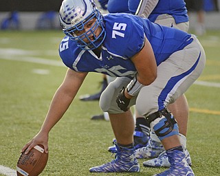 Katie Rickman | The Vindicator.Hubbard's center Wesley Best (#75) looks down the as the Eagles gear up for a play against Lakeview at Hubbard on Friday, September 18, 2015.