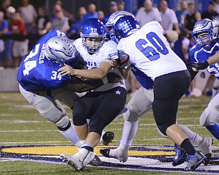 Katie Rickman | The Vindicator.Lakeview's Angelo Marino (#12) is tacked by Hubbard's Tyreek Daniels(#34) and Matt Whittenberger (#54) during the first half of the game at Hubbard on Friday, September 18, 2015..