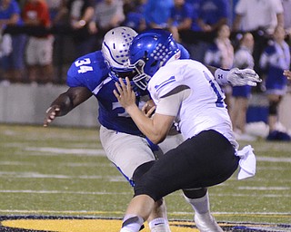 Katie Rickman | The Vindicator.Lakeview's Angelo Marino (#12) is tacked by Hubbard's Tyreek Daniels(#34) during the first half of the game at Hubbard on Friday, September 18, 2015.