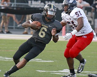 William D Lewis The Vindicator Fitch's Alonzo Williams(51) chases Lynn bowden(6) of HArding during 1rst half action 9-18-15 at Harding.