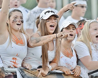 Jeff Lange | The Vindicator  SEPTEMBER 18, 2015 - Members of the Howland student section Sarah Brindley (left), Nicole Gula (center) and Kayla Ciletta (right) cheer for the Howland Tigers as they take the field against the Poland Bulldogs Friday night in Howland.