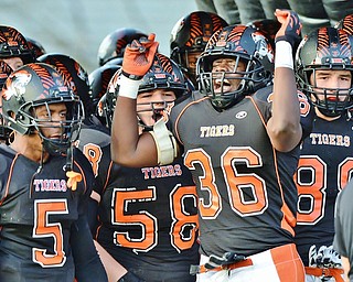 Jeff Lange | The Vindicator  SEPTEMBER 18, 2015 - Tigers' Elijah Thompkins (36) gets his teammates excited prior to taking the field in their Friday-night game against the Poland Bulldogs at Howland High School.