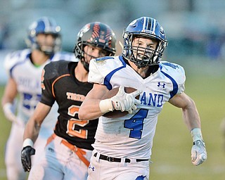 Jeff Lange | The Vindicator  SEPTEMBER 18, 2015 - Poland's Dylan Garver (4) rushes past Howland's George Beatty-Marsh late in the second quarter of their game in Howland on Friday night.