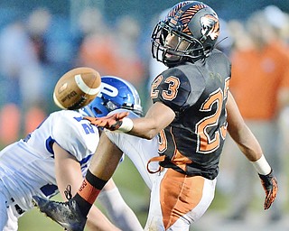 Jeff Lange | The Vindicator  SEPTEMBER 18, 2015 - Howland wide receiver Steve Baugh (23) reaches for a pass thrown just out of reach late in the second quarter of the Tigers' game against Poland at Howland High School on Friday night.