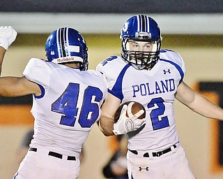 Jeff Lange | The Vindicator  SEPTEMBER 18, 2015 - Poland's Anthony Calcagni (2) celebrates his touchdown with teammate Dante Ruozzo (46) in the second quarter of their game Friday night at Howland High School.