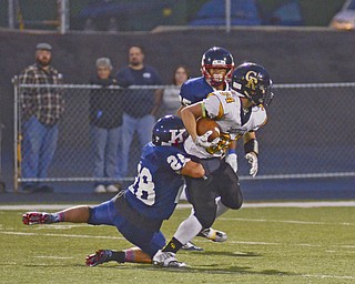 Katie Rickman | The Vindicator.Crestview's Zach Hicks (#34) is unstoppable as JFK's Dominic Campana (#28) during the first half of the game in Warren on Saturday, September 19, 2015.