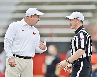 Jeff Lange | The Vindicator  SEPTEMBER 19, 2015 - Youngstown State University head football coach Bo Pelini chats with an NCAA official prior to the start of the Penguins' game against the SFU Red Flash, Saturday, September 19, 2015.
