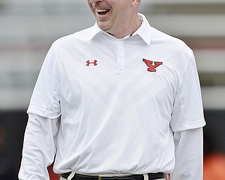 Jeff Lange | The Vindicator  SEPTEMBER 19, 2015 - Youngstown State University head football coach Bo Pelini laughs before the start of the Penguins' game against the SFU Red Flash Saturday, September 19, 2015.