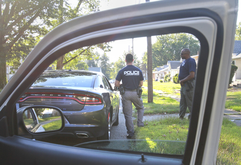 William d Lewis The Vindicator  Youngstown community police officers stop a suspected drug dealer on Youngstown's south side 9-22-15 as part of a sweep.