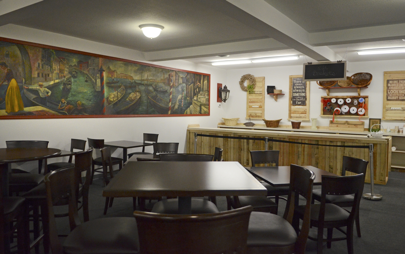 Katie Rickman | The Vindicator.Tables are available for customers who want to stay a while to eat the homemade foods from The Italian Marketplace's deli or have a gift basket custom-made. 