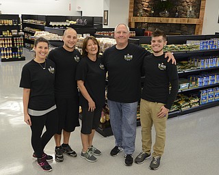 Katie Rickman | The Vindicator. The new Italian Marketplace is a family affair for Bobby and Pam Allegretto DeVicchio, center.  Working alongside their parents in the business are daughter-in-law Allie Rosati, assistant manager; and sons Anthony Rosati (Allie's husband), and Nick DeVicchio.