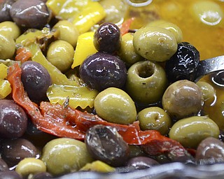 Katie Rickman | The Vindicator.Olives and peppers in olive oil is one of the many fresh foods available at The Italian Marketplace in Niles on September 21, 2015.