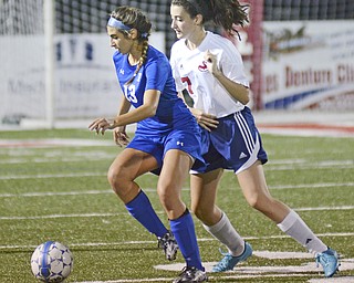 Katie Rickman | The Vindicator.Poland's Sophia Harakal (#13) pushes past Nile's Aundrea Scattino (#7) during the second half of the game on Monday September 28, 2015.