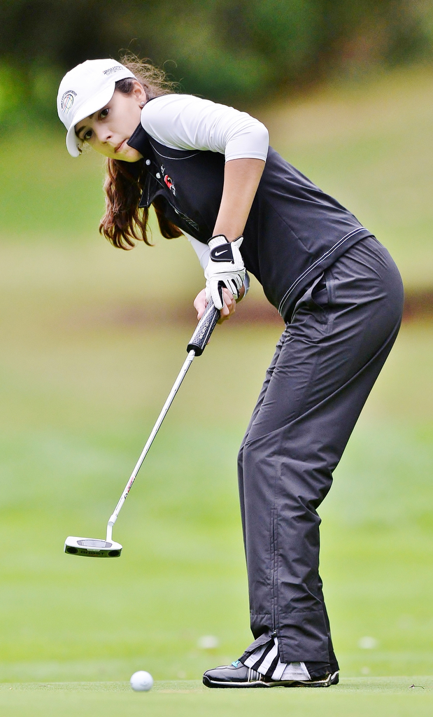 Jeff Lange | The Vindicator  SEPTEMBER 30, 2015 - Cardinal Mooney's Hadley Spielvogel watches her putt to the No. 18 hole during Wednesday's girls sectional golf tournament held at Pine Lakes Golf Club in Hubbard.