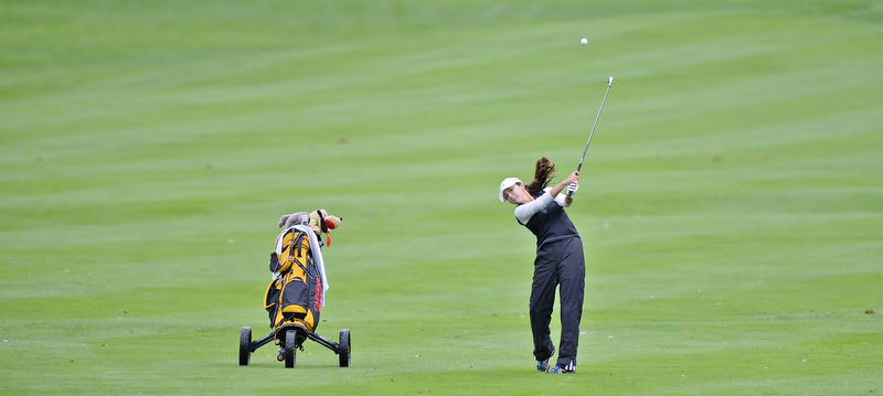 Jeff Lange | The Vindicator  SEPTEMBER 30, 2015 - Cardinal Mooney freshman Hadley Spielvogel watches her shot from the No. 1 fairway during Wednesday's girls sectional golf tournament held at Pine Lakes Golf Club in Hubbard.