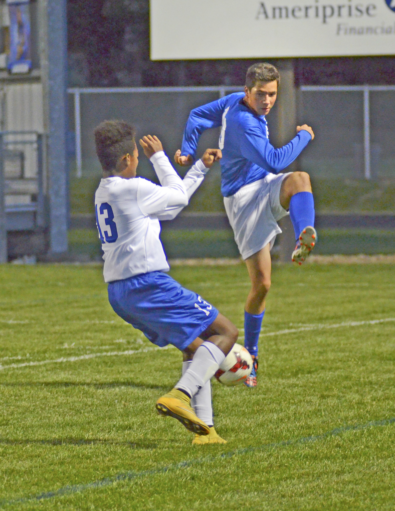 Katie Rickman | The Vindicator..Poland's Izzac Lange (#19) attempts to pass as Lakeview's  Daniel Golar (#13) blocks him during the first half of the game at Lakeview High School on October 1, 2015.