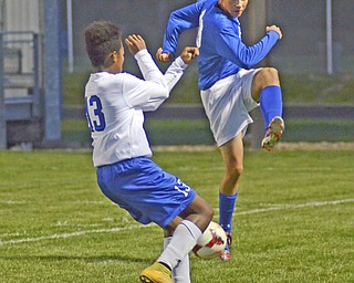 Katie Rickman | The Vindicator..Poland's Izzac Lange (#19) attempts to pass as Lakeview's  Daniel Golar (#13) blocks him during the first half of the game at Lakeview High School on October 1, 2015.
