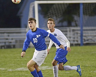 Katie Rickman | The Vindicator..Poland's Captain Joseph Shields (#10) head buts the ball as Lakeview's (#4)during the first half of the game at Lakeview High School on October 1, 2015.
