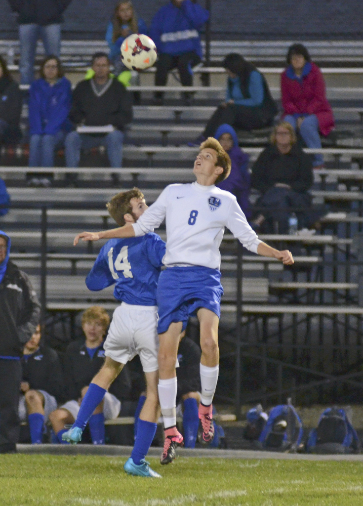 Katie Rickman | The Vindicator.Lakeview's  Brendan White (#8) and Poland's  Matthew Holsinger (#14) compete for the ball during the first half of the game at Lakeview High School on October 1, 2015.