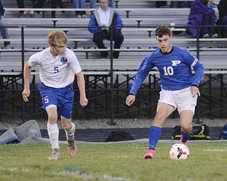 Katie Rickman | The Vindicator.Poland's  Joseph Shields (#10) moves down the field as  Lakeview's Tanner Drum (#5) during the first half of the game at Lakeview High School on October 1, 2015.