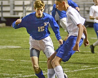 Katie Rickman | The Vindicator.Lakeview's Jeffery Remmick (#6) is blocked by Poland's MAtthew Slepski (#15) during the first half of the game at Lakeview High School on October 1, 2015.