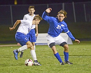 Katie Rickman | The Vindicator.Lakeview's Noah Busefink (#17) moves past Poland's Jake Buccieri (#21) during the first half of the game at Lakeview High School on October 1, 2015.