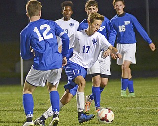 Katie Rickman | The Vindicator.Lakeview's  Noah Busefink (#17) moves up field despite  Poland's  David Watson's (#12) attempt to block him during the first half of the game at Lakeview High School on October 1, 2015.