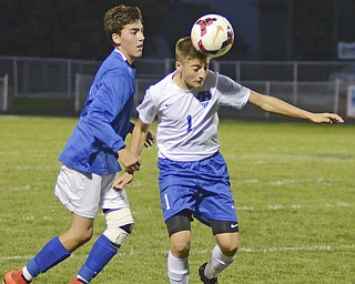 Katie Rickman | The Vindicator.Lakeview's Anthony Sylvester (#1) head butts the ball as  Poland's Trey Medvec (#11) attempts to gain control of the ball during the first half of the game at Lakeview High School on October 1, 2015.