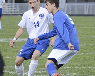 Katie Rickman | The Vindicator..Poland's  Ryan Weitzman (#9) moves down field and pushes past Lakeview's Daniel Sarko (#14)during the first half of the game at Lakeview High School on October 1, 2015.
